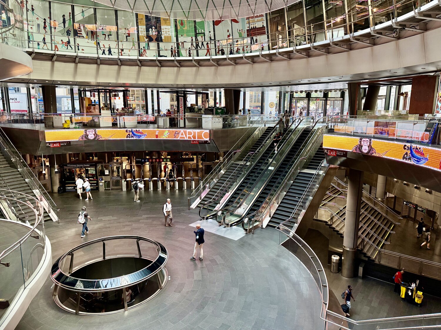 The Fulton Center atrium with escalators, mezzanine, and the circular skylight feature below